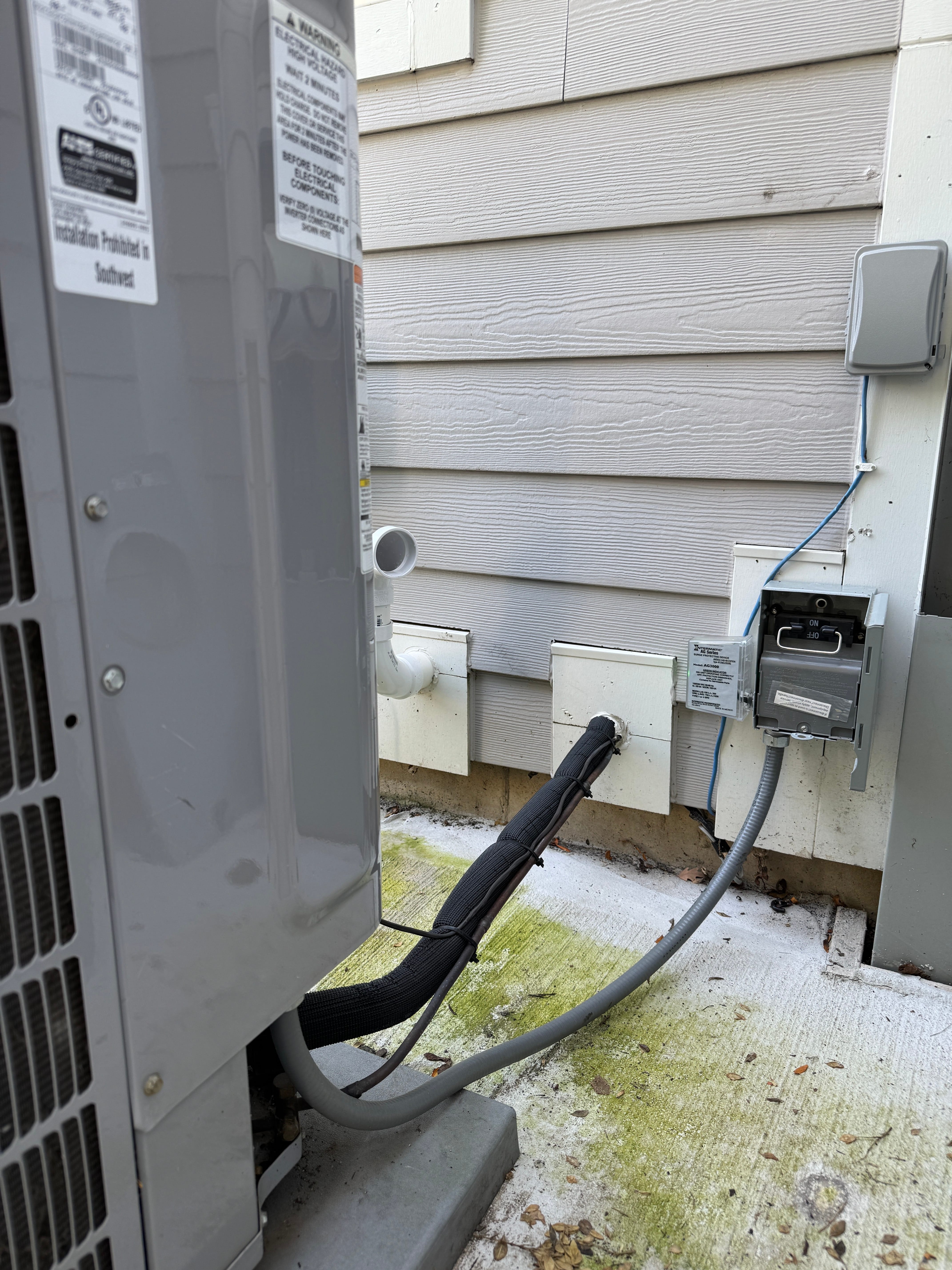 Air conditioner electrical line installation with code-compliant wiring in Chicago area home